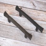 Hand forged hammered iron pull handle in antique black finish for barn doors, cabinets, wardrobes, and rustic furniture.