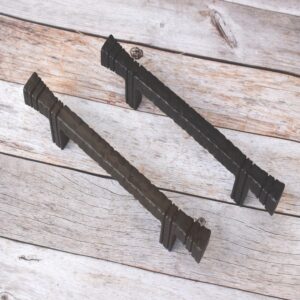 Hand forged hammered iron pull handle in antique black finish for barn doors, cabinets, wardrobes, and rustic furniture.