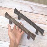 Hand forged hammered iron pull handle in antique black finish for barn doors, cabinets, wardrobes, and rustic furniture.