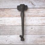Decorative elephant trunk cast iron door handle with antique black finish for barn doors, cabinets, wardrobes, gates, and rustic farmhouse furniture.