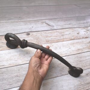 This handcrafted twisted iron pull handle is made from premium-quality forged iron and finished in antique black for a timeless rustic appearance. Designed for durability and comfort, it is perfect for barn doors, gates, cabinets, wardrobes, cupboards, and furniture, adding authentic blacksmith craftsmanship to any home.