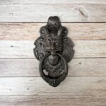 cast iron door knocker, devil face door knocker, gothic door knocker, ram horn door knocker, antique door knocker, vintage front door hardware, medieval door knocker, rustic door knocker, decorative door knocker, heavy duty cast iron knocker