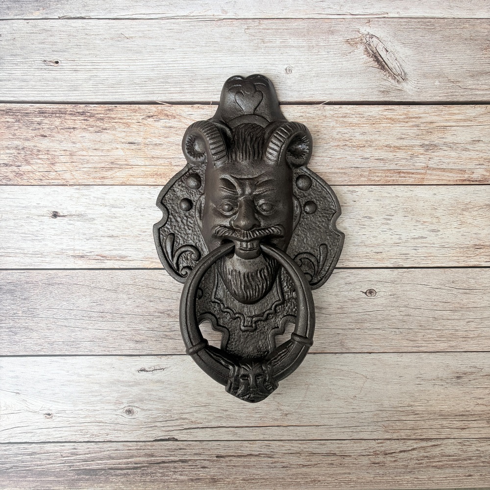 cast iron door knocker, devil face door knocker, gothic door knocker, ram horn door knocker, antique door knocker, vintage front door hardware, medieval door knocker, rustic door knocker, decorative door knocker, heavy duty cast iron knocker