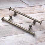 Antique Iron Cabinet Pull Handle Premium antique brass iron cabinet pull handle for kitchen cabinets, drawers, wardrobes, dressers, and furniture with heavy-duty cylindrical design.