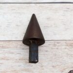 Solid steel tapered cone hardy tool with square shank for blacksmith anvil and precision metal forming.