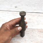 Solid steel rivet heading stake with square shank for blacksmithing, riveting, jewelry making, and precision metal forming.