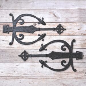 Decorative cast iron spear strap hinge pair with scroll design and antique black finish for barn doors, wooden gates, carriage doors, and farmhouse hardware.
