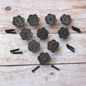 Decorative cast iron flower cabinet knobs with an antique black finish, perfect for vintage, farmhouse, and rustic furniture.