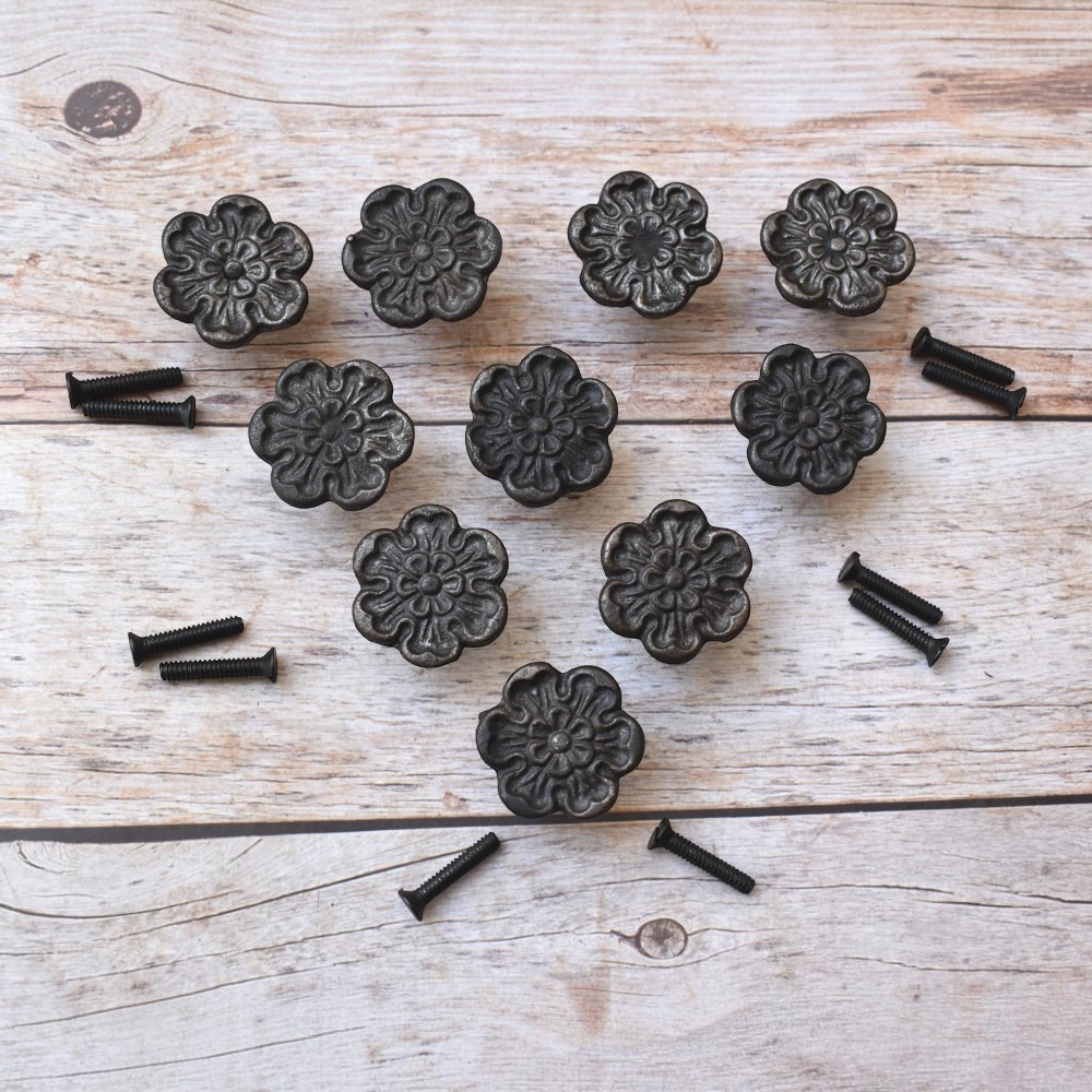 Decorative cast iron flower cabinet knobs with an antique black finish, perfect for vintage, farmhouse, and rustic furniture.
