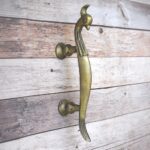 Vintage cast iron peacock door handle with antique yellow finish for wooden doors, gates, cabinets, wardrobes, and rustic furniture.