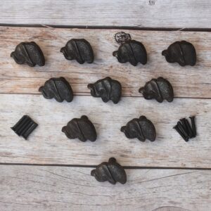 Set of 10 cast iron elephant cabinet knobs with antique black finish and mounting screws for dresser drawers, kitchen cabinets, cupboards, wardrobe doors, and rustic furniture.