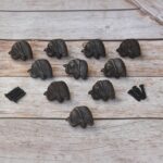 Set of 10 cast iron elephant cabinet knobs with antique black finish and mounting screws for dresser drawers, kitchen cabinets, cupboards, wardrobe doors, and rustic furniture.