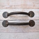 Pair of handcrafted solid iron rustic door pull handles for wooden barn doors, entrance doors, and garden gates.