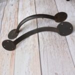 Pair of handcrafted solid iron rustic door pull handles for wooden barn doors, entrance doors, and garden gates.