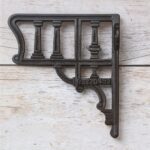 Vintage cast iron decorative shelf bracket with antique black finish for farmhouse floating wooden wall shelves.