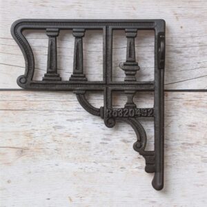 Vintage cast iron decorative shelf bracket with antique black finish for farmhouse floating wooden wall shelves.