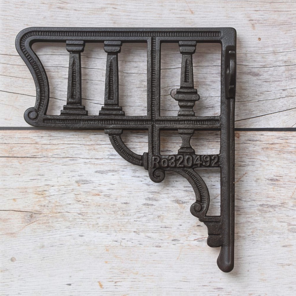 Vintage cast iron decorative shelf bracket with antique black finish for farmhouse floating wooden wall shelves.