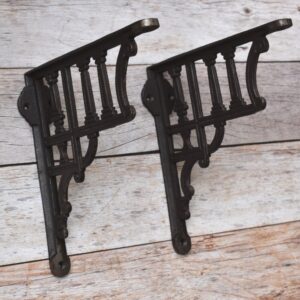 Vintage cast iron decorative shelf bracket with antique black finish for farmhouse floating wooden wall shelves.