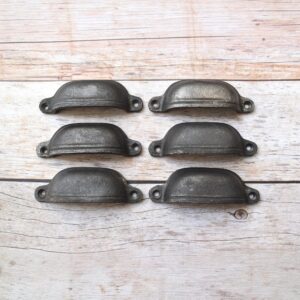 Plain cast iron cup pull handles with antique black finish for cabinets, drawers, and furniture.