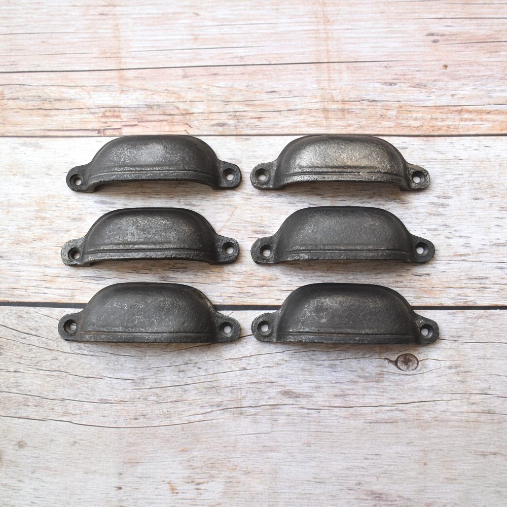 Plain cast iron cup pull handles with antique black finish for cabinets, drawers, and furniture.
