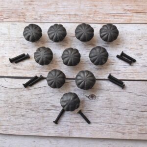 Set of rustic cast iron pumpkin cabinet knobs with antique black finish for cabinets, drawers, cupboards, wardrobes, dressers, and farmhouse furniture.