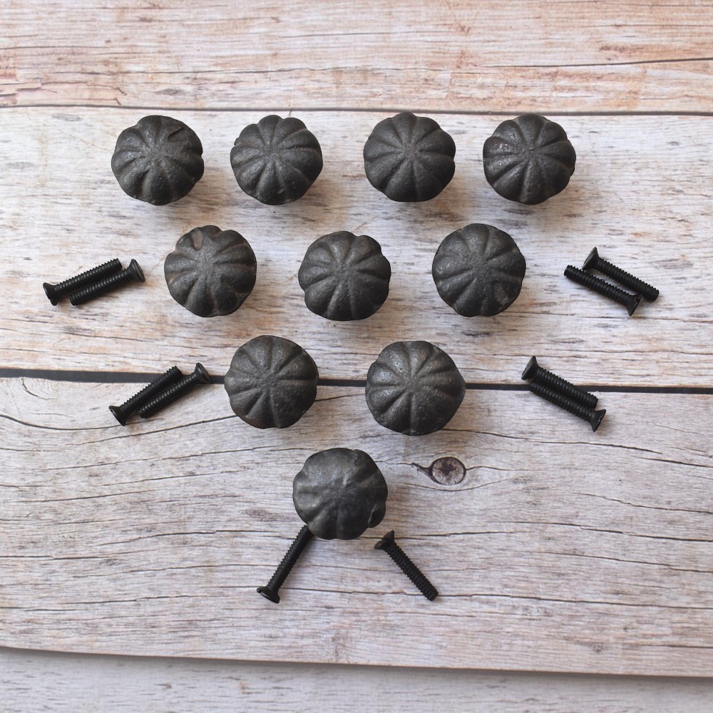 Set of rustic cast iron pumpkin cabinet knobs with antique black finish for cabinets, drawers, cupboards, wardrobes, dressers, and farmhouse furniture.