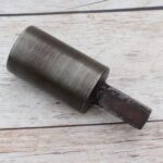 Steel round hardy tool stake holder for blacksmith anvil used in metal forging and fabrication.