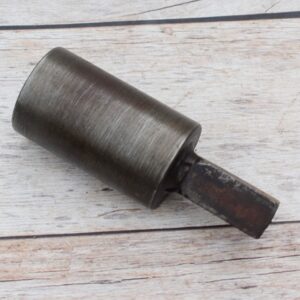 Steel round hardy tool stake holder for blacksmith anvil used in metal forging and fabrication.