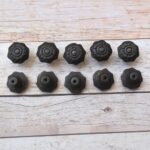 Set of 10 vintage cast iron flower cabinet knobs with mounting screws for kitchen cabinets, drawers, wardrobes, cupboards, and furniture.