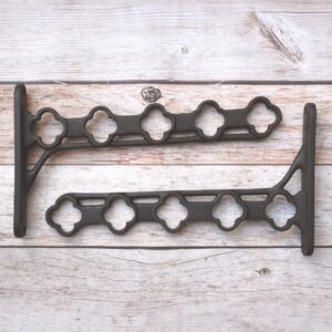 Heavy-duty cast iron hanging basket bracket with decorative quatrefoil design, antique black finish, ideal for hanging flower baskets, lanterns, bird feeders, and planters.