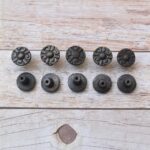 Set of 10 vintage cast iron round floral cabinet knobs with mounting screws for drawers, cabinets, wardrobes, cupboards, and furniture.