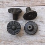 Set of 10 vintage cast iron round floral cabinet knobs with mounting screws for drawers, cabinets, wardrobes, cupboards, and furniture.