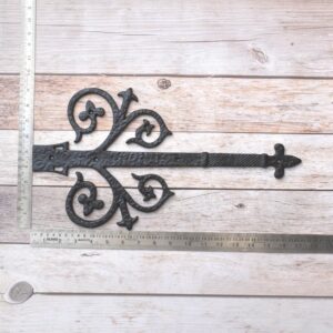 Vintage cast iron Fleur-de-Lis decorative strap hinge pair with ornate scroll design and antique black finish for barn doors, gates, shutters, and rustic farmhouse décor.