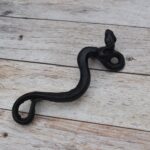 black painted cast iron rattlesnake door pull handle for barn doors, gates, cabinets, wardrobes, and rustic furniture.