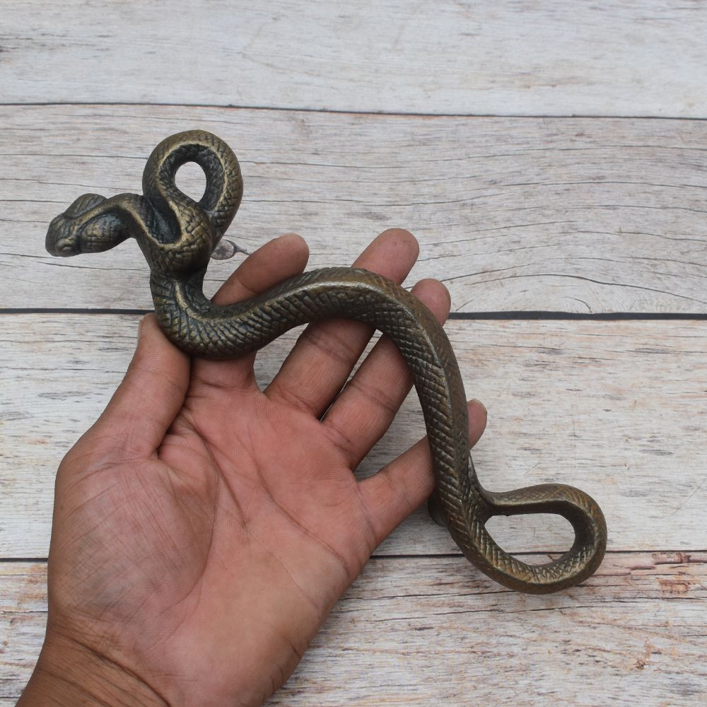 Vintage cast iron rattlesnake door pull handle with antique brass finish for barn doors, gates, cabinets, and rustic furniture.