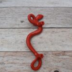 Red cast iron rattlesnake door pull handle for barn doors, gates, cabinets, wardrobes, and rustic furniture.