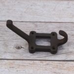 Bring classic rustic style and practical storage to your space with this Set of 4 Cast Iron Wall Coat Hooks. Each hook features a sturdy raised arm, a convenient lower hook, and a decorative rectangular backplate for a distinctive vintage look. Made from durable cast iron with a dark antique finish, these hooks are ideal for coats, hats, bags, scarves, towels, keys, and other everyday items. Perfect for entryways, mudrooms, bedrooms, bathrooms, kitchens, workshops, cabins, and farmhouse-style interiors.