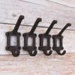 Vintage Decorative Design – Classic raised hook design with a distinctive rectangular backplate adds rustic character to any wall. Solid Cast Iron Construction – Crafted from durable cast iron for strength, stability, and long-lasting everyday use. Dual Hanging Function – Features an upper hook and lower curved hook for convenient hanging and organized storage. Rustic Antique Finish – Dark finish complements farmhouse, vintage, industrial, cottage, and traditional décor. Set of 4 Hooks – Includes four matching wall hooks, perfect for creating a coordinated storage solution in your home. Versatile Storage Solution – Ideal for coats, hats, bags, scarves, towels, keys, leashes, and other accessories. Secure Wall Mounting – Multiple mounting holes in the sturdy backplate provide a secure installation on suitable surfaces. Perfect for Home & DIY Projects – Great for entryways, mudrooms, bedrooms, bathrooms, cabins, workshops, furniture projects, and rustic renovations.