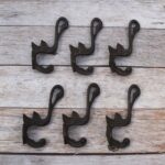 Set of 6 vintage cast iron swan wall hooks with antique dark finish for coats, hats, bags, keys, and rustic home décor.