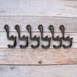 Set of 6 vintage cast iron swan wall hooks with antique dark finish for coats, hats, bags, keys, and rustic home décor.