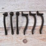 Set of 6 vintage hammered iron door pull handles with rustic dark finish for barn doors, cabinets, drawers, wardrobes, and furniture.