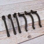 Set of 6 vintage hammered iron door pull handles with rustic dark finish for barn doors, cabinets, drawers, wardrobes, and furniture.