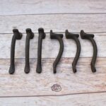 Set of 6 vintage hammered iron door pull handles with rustic dark finish for barn doors, cabinets, drawers, wardrobes, and furniture.
