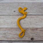 Yellow cast iron rattlesnake door pull handle for barn doors, gates, cabinets, wardrobes, and rustic furniture.