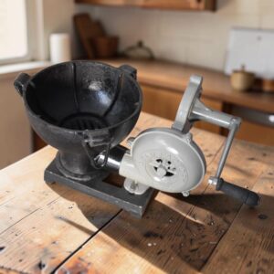 Vintage-style manual cast iron forge blower designed for blacksmithing, metal forging, and traditional workshop use.