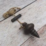 vintage plumb bob, iron plumb bob, antique plumb bob, masonry plumb bob, carpenter plumb bob, survey plumb bob, builder alignment tool, traditional measuring tool, iron measuring tool, woodworking tool, construction tool, vintage reproduction tool, restoration tool, hanging plumb bob, mason tool, carpenter tool, antique workshop tool, handcrafted iron tool, vintage hardware, collectible antique tool