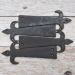 vintage strap hinges, fleur de lis hinges, decorative iron hinges, rustic door hinges, barn door hinges, gate hinges, antique style hinges, farmhouse hardware, vintage door hardware, decorative strap hinge, rustic cabinet hinges, iron door hardware, shed door hinges, furniture hinges, restoration hardware, cottage door hardware, traditional door hinges