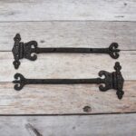 Pair of Ornate Fleur-de-Lis End Black Wrought Iron Strap Hinges