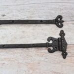 Pair of Ornate Fleur-de-Lis End Black Wrought Iron Strap Hinges