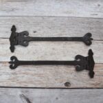 Pair of Ornate Fleur-de-Lis End Black Wrought Iron Strap Hinges